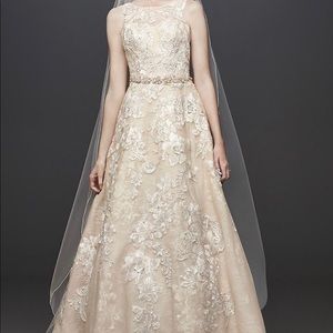 New, with tags, Oleg Cassini Wedding Gown. Size 14